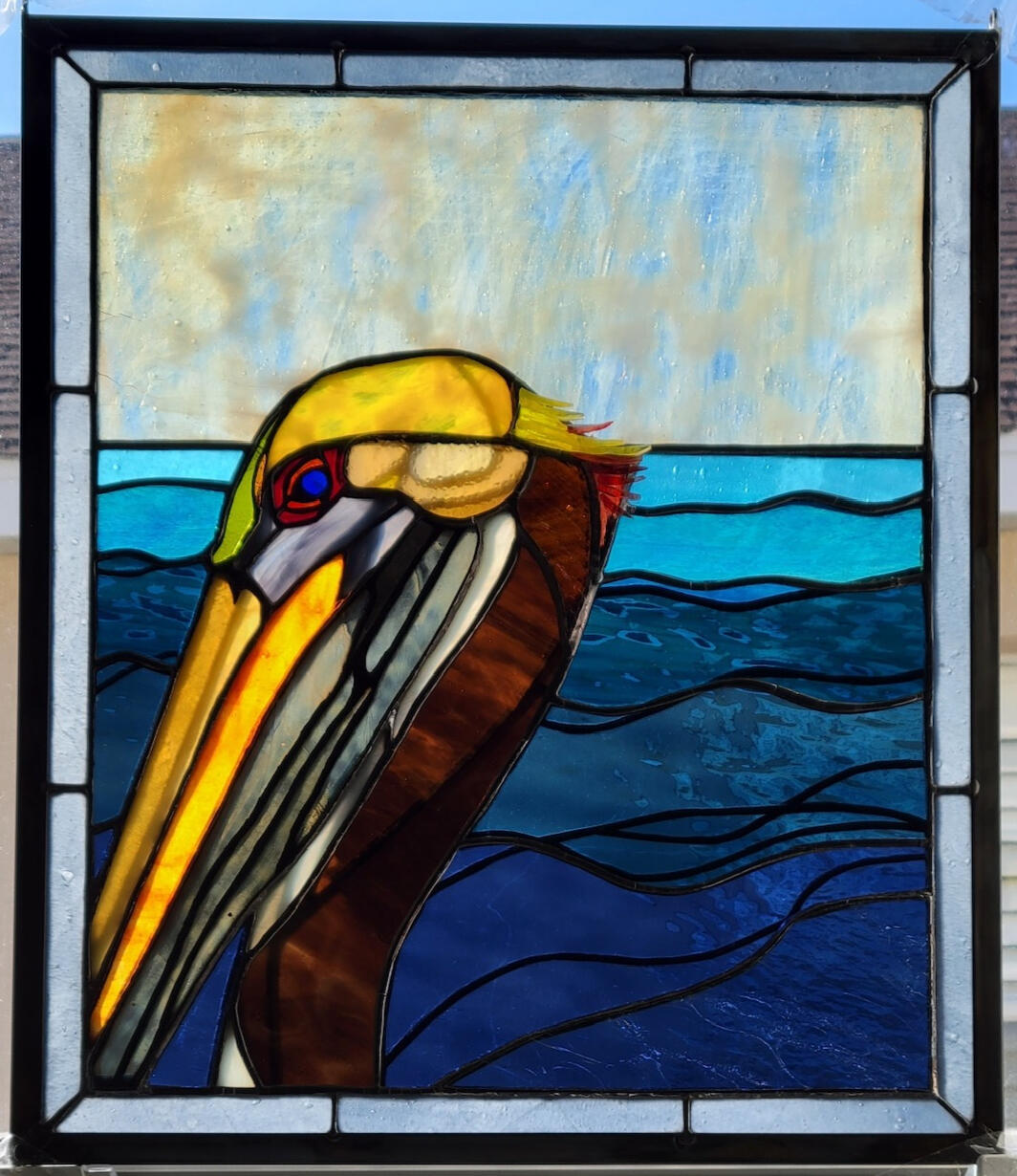 “Recovery of the Magnificent Brown Pelican” made in plated glass technique
